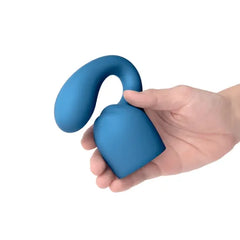 Hand holding the blue Glider Petite attachment, showing its flexible silicone body
