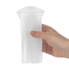 Hand holding the clear Lovense Max 2 Neutral Sleeve upright to show flexible size and grip