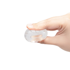 Hand holding the clear Stretch-Tech Barrel to show its compact, pliable form
