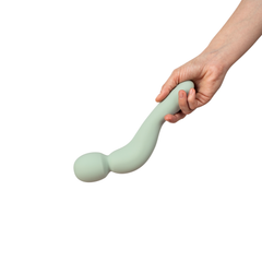 Hand holding Dame Com 2.0 Wand vibrator horizontally, showing flexible neck and head size