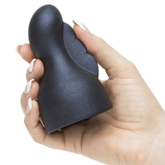 Hand holding Doxy Nexus silicone attachment to show compact palm-fitting size