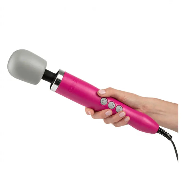 Hand holding the Doxy wand massager showing comfortable grip size and corded design