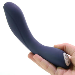 Hand holding Evolved Coming Strong vibrator showing ergonomic curved shape and dual control buttons