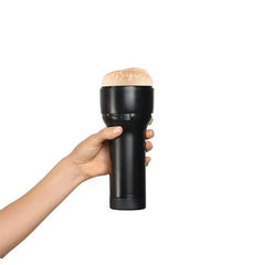 Hand holding the FeelReagan Foxx Stroker showing ergonomic black case grip size