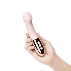 Hand holding Gee vibrator showing compact ergonomic size and three-button controls