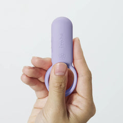 Hand holding iroha paiRING to show compact size and flexible ring fit