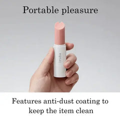 Hand holding Iroha pink stick vibrator upright, compact portable size with anti-dust coating