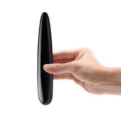 Hand holding Le Wand Crystal Slim Wand vertically, showing slim profile and tapered tip