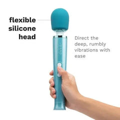 Hand holding Le Wand Dive wand massager, with callout noting its flexible silicone head