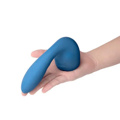 Hand holding Le Wand Flexi Petite blue silicone attachment to show compact size