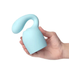 Hand holding Le Wand Glider attachment upright, showing soft matte silicone texture