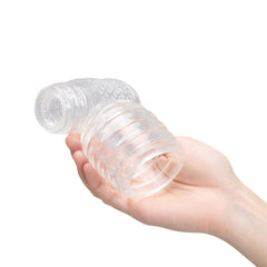 Hand holding Le Wand Slider attachment, demonstrating flexible clear material and compact size