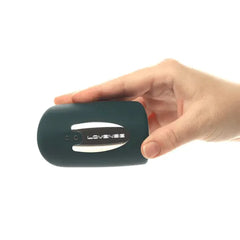 Hand holding Lovense Gush to show compact palm-sized scale and soft matte silicone finish