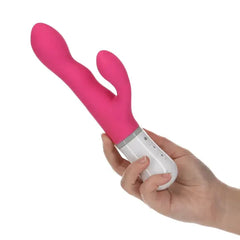 Hand holding the Lovense Nora pink rabbit vibrator to show ergonomic grip size