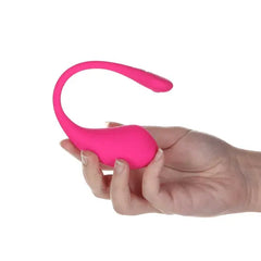 Hand holding pink Lovense Lush 3 egg vibrator to show compact wearable size