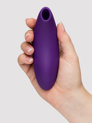 Hand holding purple We-Vibe Melt 2 from front, showing smooth matte silicone finish