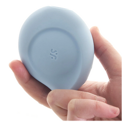 Hand holding the Satisfyer Sugar Rush showing its compact, palm-sized silicone body in blue