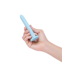 Hand holding smallest b-Vibe light blue silicone dilator demonstrating compact length