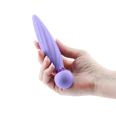 Hand holding Sugar Pop Twist purple ribbed vibrator showing compact size and ball-end control button