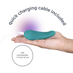 Hand holding teal massager connected to white USB cable; USB rechargeable, 1.5 hours use