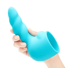 Hand holding teal silicone ribbed wand attachment upright, displaying curved shape and sleeve opening