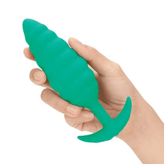 Hand holding teal Twist anal plug to show palm-sized scale and soft silicone feel