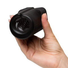 Hand displaying the open end of the Zing stroker, highlighting the swirling internal sleeve texture