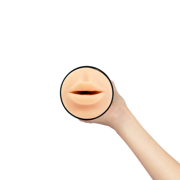 Hand presenting Feel Stroker mouth masturbator from above, highlighting realistic lip detail