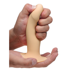 Hand squeezing the Squeezable Phallic Dildo shaft showing premium soft silicone flexibility
