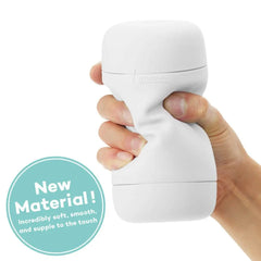 Hand squeezing Tenga Puffy Sugar White, demonstrating new soft and supple flexible material