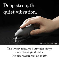 Hand submerging dark Iroha+ vibrator in water highlighting waterproof design