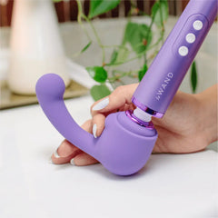 Hands attaching purple Curve Petite silicone head onto Le Wand Petite wand massager