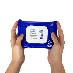 Hands displaying Dame Body Wipes 12-count pack face-on, highlighting multi-purpose label detail