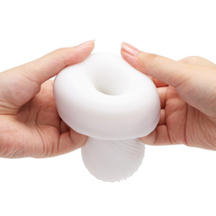 Hands opening top of white gel sleeve to reveal interior ribbed canal structure