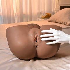 Hands-on scale reference showing lifelike texture and generous size of the dark-tone stroker