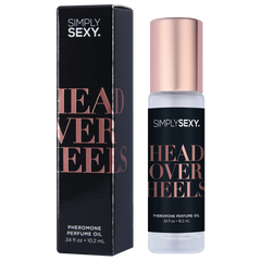 Head Over Heels perfume oil roll-on beside its slim black and rose-gold gift box, 0.34 fl oz