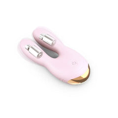 Hear Me vibrator laying flat showing dual silver magnetic charging pins on each ear tip