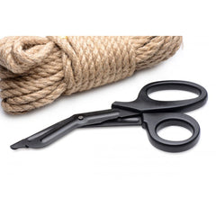 Heavy Duty Bondage Scissors laid beside coiled natural hemp rope, highlighting safety-tip blades