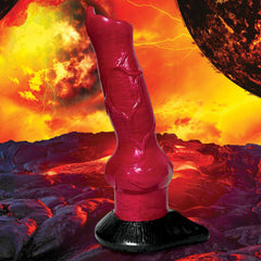 Hell-Hound canine silicone dildo displayed upright against a dramatic fiery hellscape backdrop