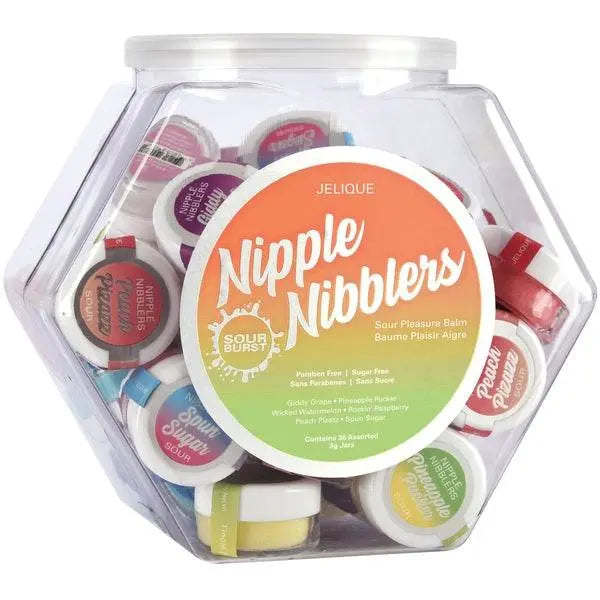 Hexagonal clear display bowl filled with colourful Nipple Nibblers 3g single-serve balm jars