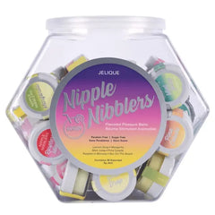 Hexagonal clear display jar of Nipple Nibblers paraben-free balm showing assorted flavor labels