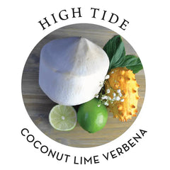 High Tide scent blend featuring coconut, lime, and verbena botanicals on a wood surface