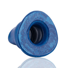 Close-up of hollow tunnel opening on blue Oxballs Pighole Morph plug, ribbed interior