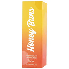 Close-up of Honey Buns box showing warm yellow-orange gradient and bold white script logo