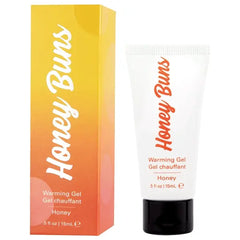 Honey Buns warming gel beside its yellow-to-orange gradient box, honey flavor, 0.5 fl oz