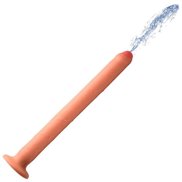 Hosed 15-inch flesh-tone silicone enema hose with suction base, shown spraying water