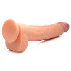 Hung Harry 11.75" dildo lying flat, displaying full profile of shaft, balls, and suction base