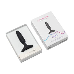 Hush 2 butt plug displayed beside its white retail box, open inner tray visible