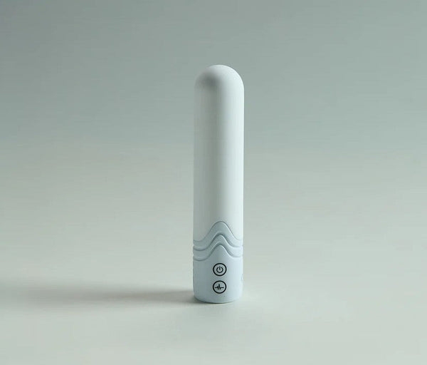 Illumination The Bullet Vibrator in matte white finish standing upright, showing wave grip and control buttons