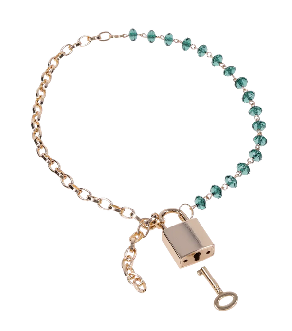 Indica Crystal Day Collar close-up showing teal acrylic crystal beads, gold rolo chain and key charm
